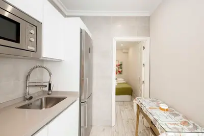 Una cocina o zona de cocina en Apartamentos Recaredo 7, Áticos con terraza