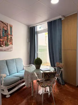 Zona de estar de Apartamentos La Casa del Azafrán