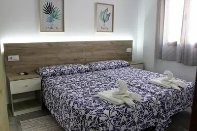 Cama o camas de una habitación en Pensión Guerrero