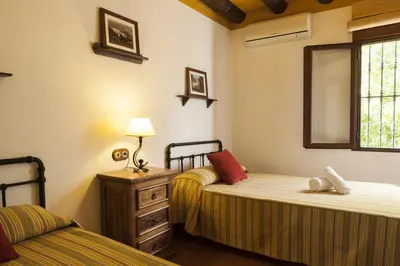 Cama o camas de una habitación en Cortijo La Algallumbilla