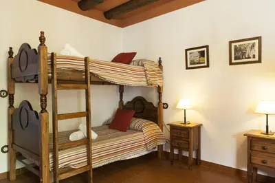 Cama o camas de una habitación en Cortijo La Algallumbilla