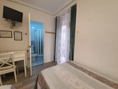 Cama o camas de una habitación en Pensión Martín