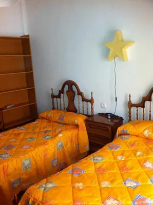 Cama o camas de una habitación en Pensión Ruiz
