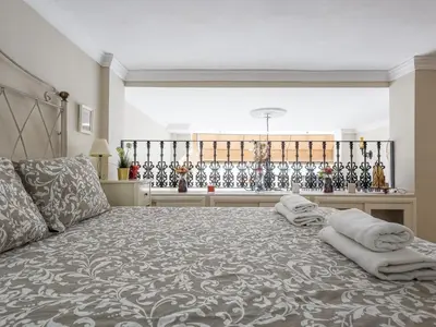 Cama o camas de una habitación en Sueños de Sevilla duplex a calidades