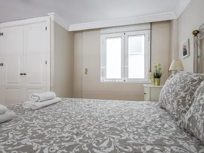 Cama o camas de una habitación en Sueños de Sevilla duplex a calidades