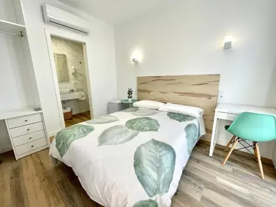 Cama o camas de una habitación en La Despensa de la Corredera Hostal