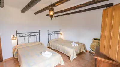 Cama o camas de una habitación en Casa Dehesa de las Casas Algarinejo by Ruralidays
