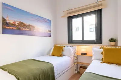 Cama o camas de una habitación en Hommyhome San Bartolomé