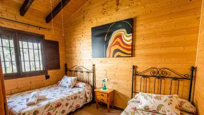 Cama o camas de una habitación en Casita de Madera Ardales by Ruralidays