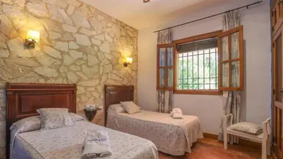 Cama o camas de una habitación en Casa Huerta El Fontanarillo Montemayor by Ruralidays