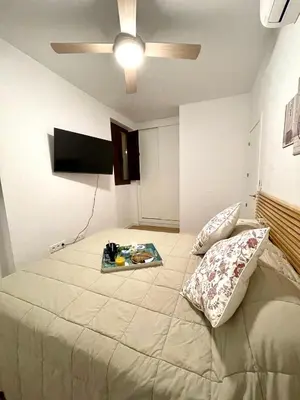 Cama o camas de una habitación en Remolars Sevilla
