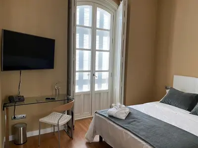 Una televisión o centro de entretenimiento en HOTEL CASABLANCA BOUTIQUE
