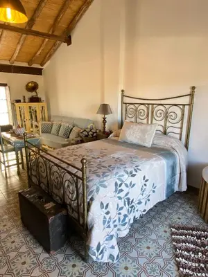 Cama o camas de una habitación en El Escondite de Martina, Áticos Románticos