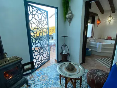 Cama o camas de una habitación en El Escondite de Martina, Áticos Románticos