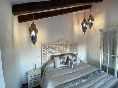Cama o camas de una habitación en El Escondite de Martina, Áticos Románticos