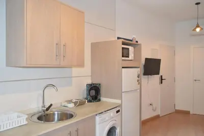 Una cocina o zona de cocina en ALCAZAR VIEJO PARKING Tourist Córdoba