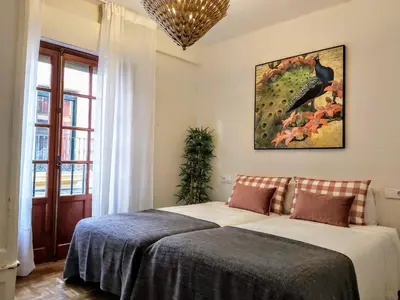 Cama o camas de una habitación en Misterhost Santa Cruz II -Jardines de Murillo