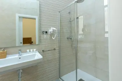 Un baño de Nine O Clock San Agustin Suites