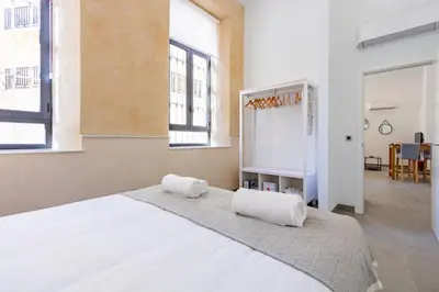 Cama o camas de una habitación en Nine O Clock San Agustin Suites