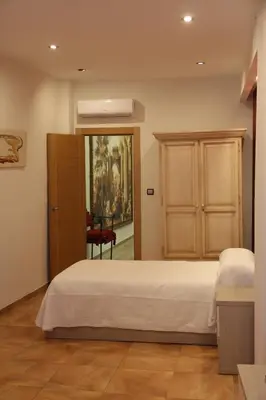 Cama o camas de una habitación en Hostal Poeta Machado