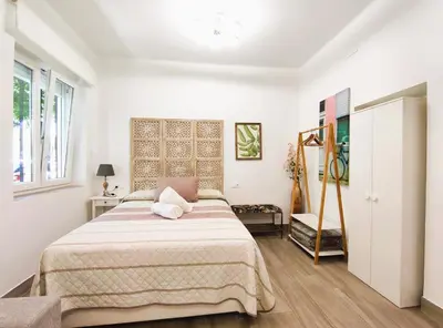 Cama o camas de una habitación en FLEMING Loft PARKING Tourist Córdoba
