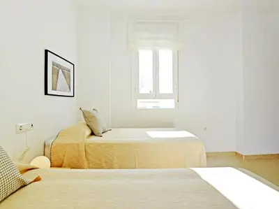 Cama o camas de una habitación en Apartamentos Santiago