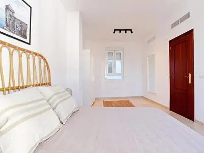 Cama o camas de una habitación en Apartamentos Santiago