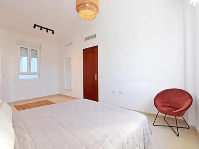 Cama o camas de una habitación en Apartamentos Santiago