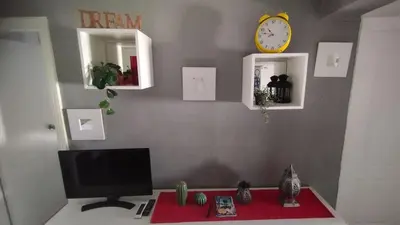 Una televisión o centro de entretenimiento en Apartamento 1 dormitorio y salon con sofa cama bien comunicado con el centro