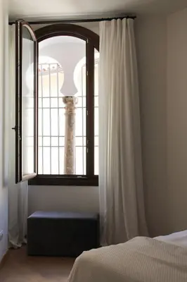 Cama o camas de una habitación en La Ermita Suites - Único Hotel Monumento de Córdoba