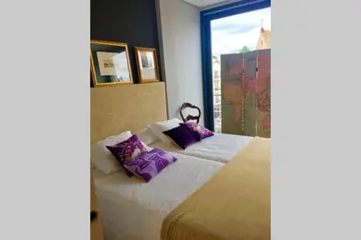 Cama o camas de una habitación en IMAGEN SUITE