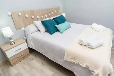 Cama o camas de una habitación en Pablo Neruda Tourist Home