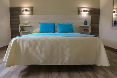 Cama o camas de una habitación en Hostal Restaurante el Cary