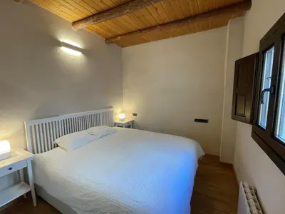 Cama o camas de una habitación en APARTAMENTOS RURALES POSADA DE LLERENA