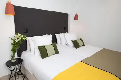 Cama o camas de una habitación en Azahar de Sevilla Apartments
