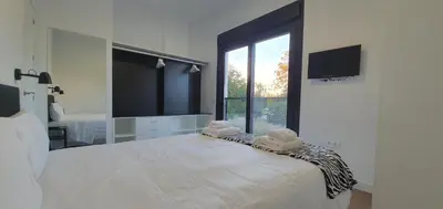 Cama o camas de una habitación en CARLOS APARTAMENTo