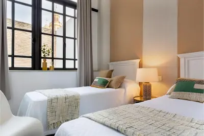 Cama o camas de una habitación en Genteel Home Alhóndiga Sevilla