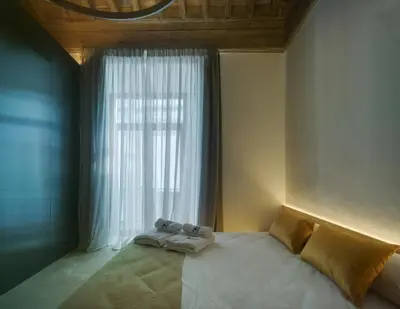 Cama o camas de una habitación en Apartamentos Los Patios del Pañuelo