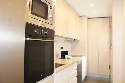 Una cocina o zona de cocina en Sevilla SantaJusta PG Apartamentos