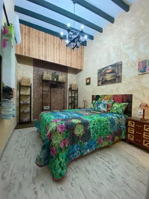 Cama o camas de una habitación en Tu rincón sevillano
