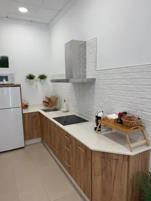 Una cocina o zona de cocina en APARTAMENTO TURISTICO LEO BAENA