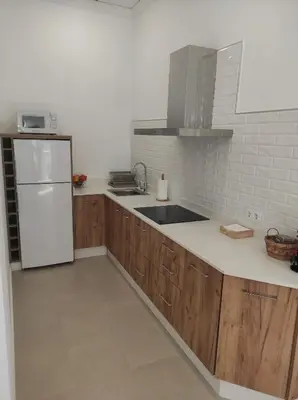Una cocina o zona de cocina en APARTAMENTO TURISTICO LEO BAENA