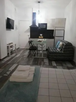 Una televisión o centro de entretenimiento en Modernos Apartamentos en Ciudad Jardín Córdoba