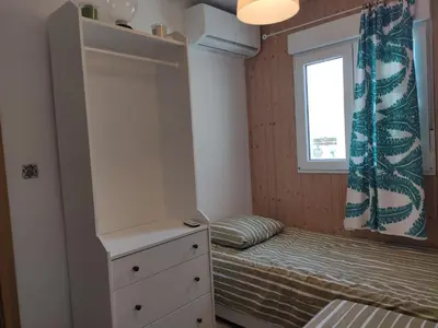 Cama o camas de una habitación en Luminoso y acogedor apartamento junto a la Macarena de Sevilla