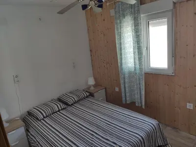 Cama o camas de una habitación en Luminoso y acogedor apartamento junto a la Macarena de Sevilla
