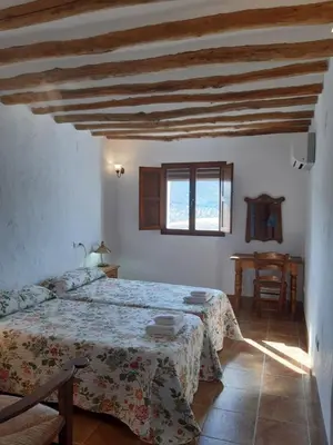 Cama o camas de una habitación en La Posada Amena