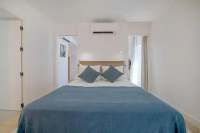 Cama o camas de una habitación en Victoria Suites Apartments
