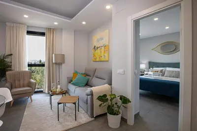 Cama o camas de una habitación en Apartamentos Ribera 19