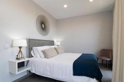 Cama o camas de una habitación en Apartamentos Ribera 19