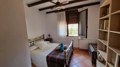Cama o camas de una habitación en Aljubea, tu casa rural en Cordoba